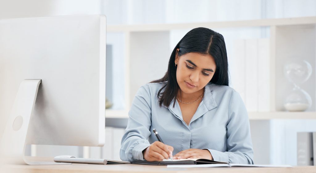 Business woman writing notes, schedule and planning ideas, meeting administration and research in n